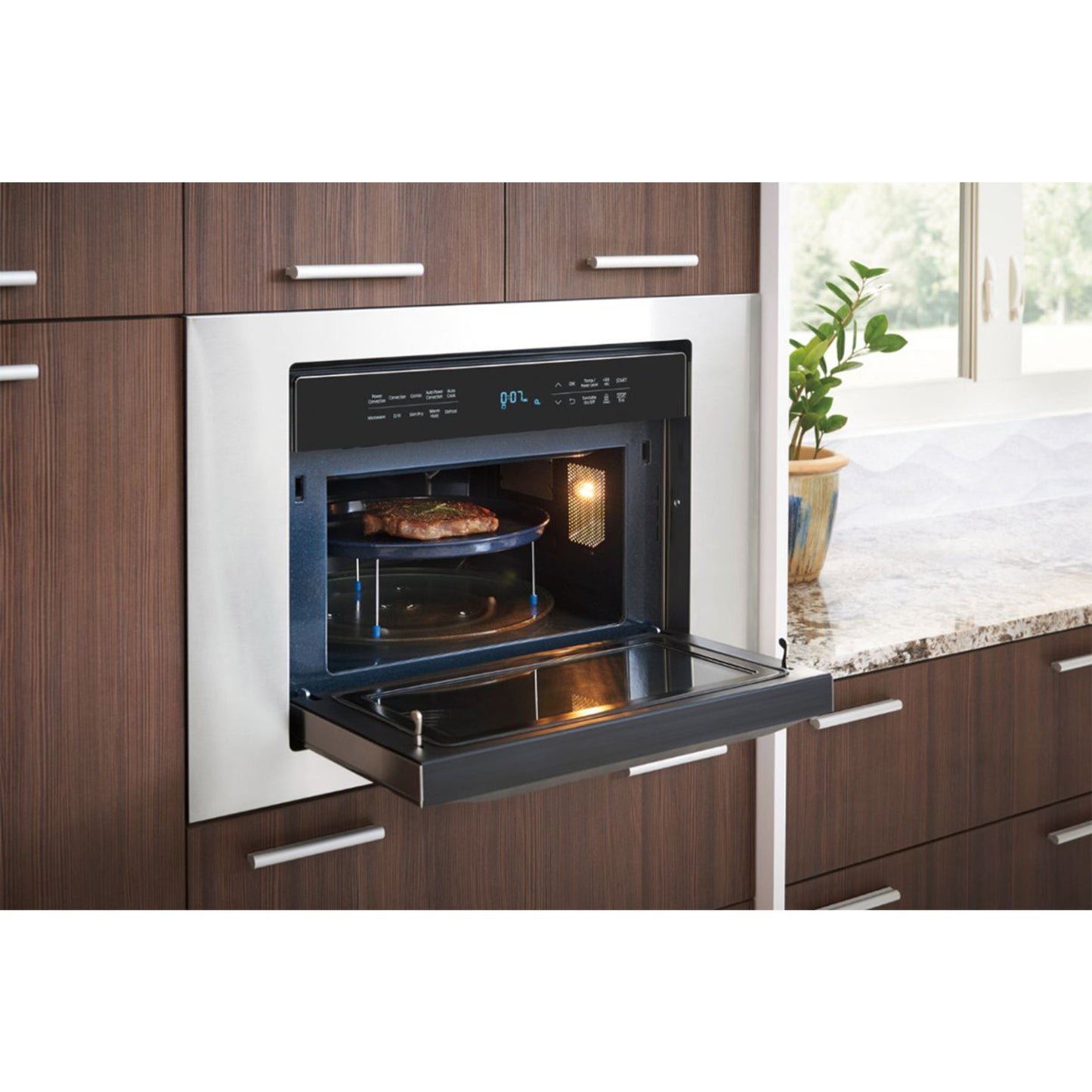 1.2 cu. ft. PowerGrill Duo™ Countertop Microwave with Power Convection and Built-In Application in Black.